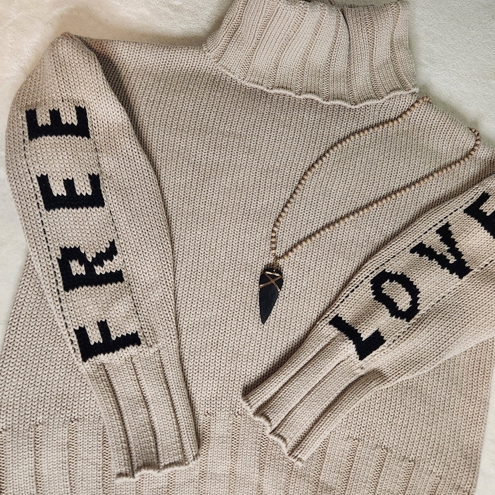Elan Beige Turtleneck Sweater with Black Sleeve Lettering